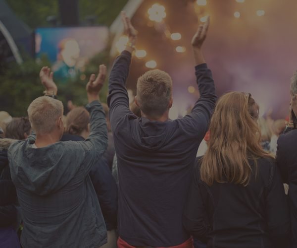 adoring-audience-a-crowd-dancing-at-an-outdoor-mus-HY57PKH.jpg